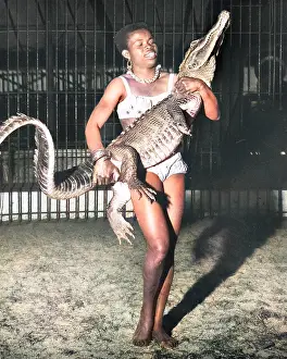 Taming: Woman with alligator, Chipperfield's Circus