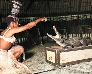 Taming: Woman with alligator, Chipperfield's Circus