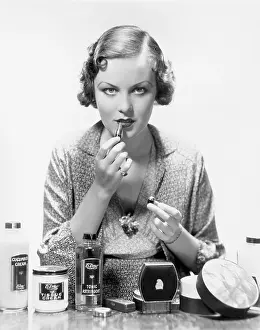 Intensity: Woman applying cosmetics