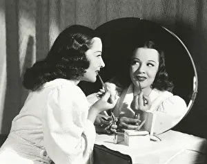 Good Looking: Woman applying lip liner