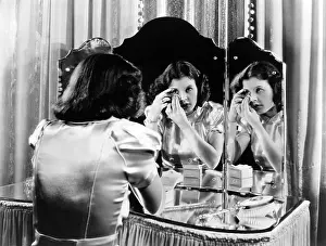 Blush: Woman applying makeup