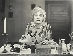 Beautify: Woman applying perfume to her lips
