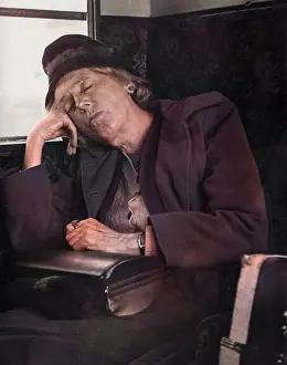 Snoozing: Woman asleep on a train