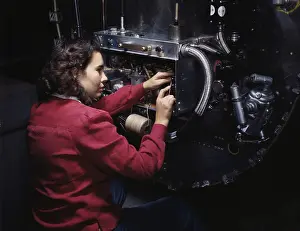 Accuracy: Woman assembling switch boxes on the firewalls