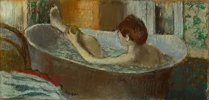 Toilette: Woman in her bath, washing a leg