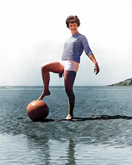 Andrew Besley: Woman on beach with ball