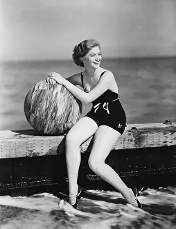 Chilling: Woman with a beach ball