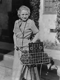 Bicyclist: Woman with bicycle and radio