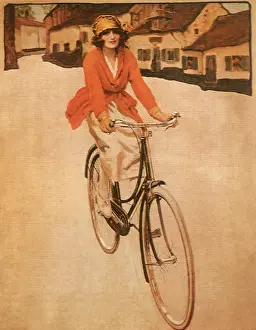 Bicycling: Woman Biking in Town