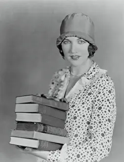 Literacy: Woman with books, ready to study