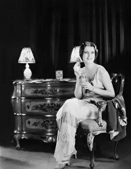 Smells: Woman with bottle of perfume