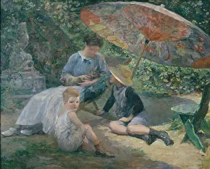 Woman and two boys with sunshade