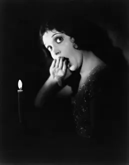 Yawns: Woman with candle yawning