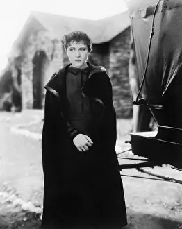 Lamenting: Woman in a cape looking very anxious