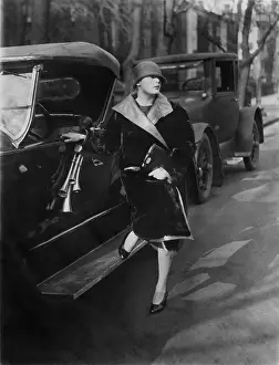Dewey: Woman beside car