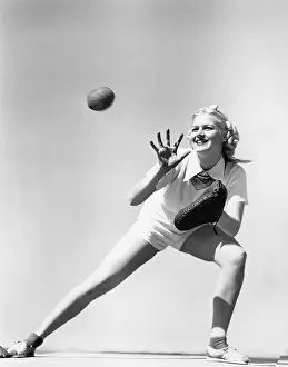 Mitt: Woman catching a baseball