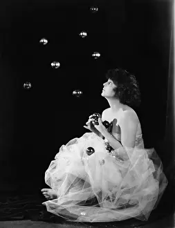 Ethereal: Woman catching floating balls