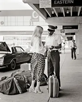 Curbside: Woman Checking Bags Curbside