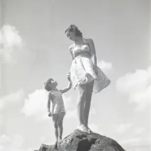 Peacetime: Woman and child on a rock