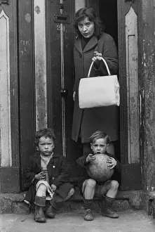 Doorstep: Woman and two children