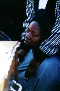 Comforted: A woman is comforted while weeping alongside a
