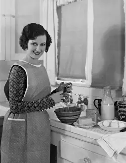 Beaters: Woman cooking in kitchen