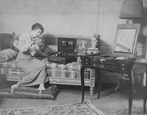 Cosmetics: Woman with her cosmetics case, 1913