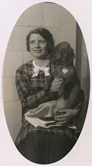 Pleated: Woman with a dachshund on her lap