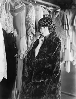 Deciding: Woman deciding what to wear