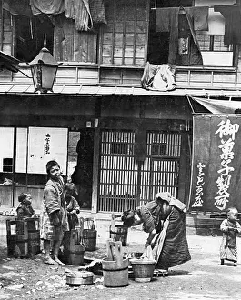 Backyard: Woman doing laundry in Japan, ca. 1911