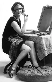 Powdering: Woman doing makeup in the 1920s