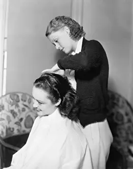Beautician: One woman doing an other woman's hair