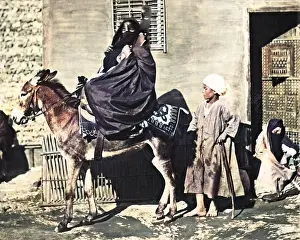Veiled: Woman on a donkey, Egypt