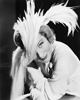 Uncommon: Woman in a dramatic feather hat