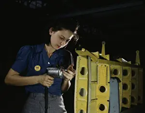 Repairing: Woman drilling horizontal stabilizers on an