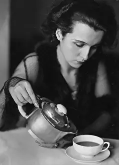 Ladieswear: A woman drinking coffee, 1935