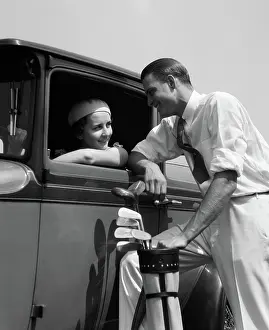 Chatter: Woman in driver's seat of car leaning out of