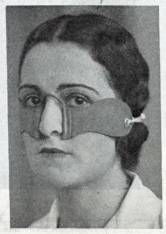 Sore: Woman in Eye Strap