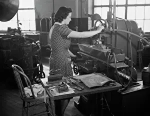 Machinist: Woman factory worker operating machine, 1942