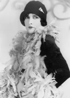 Loveliness: Woman in a feather boa and hat