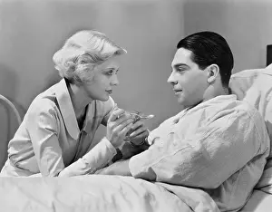 Compassion: Woman feeding patient