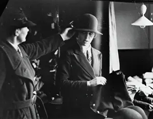 Woman being fitted with policewoman's uniform