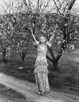 Worshiping: Woman with flowering trees