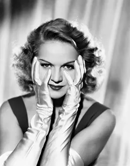 Gloved: Woman framing her face with satin gloved hands