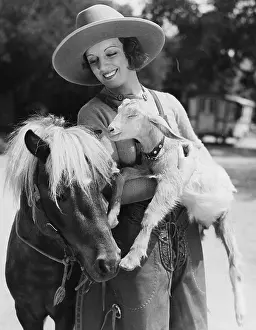 Companionship: Woman with goat and pony