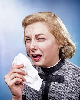 Sufferer: Woman with Handkerchief Sneezing