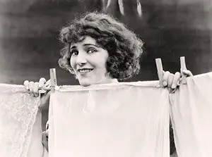 Clothesline: Woman hanging the laundry out to dry