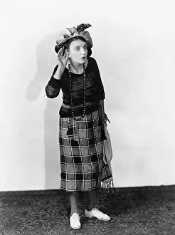 Elders: Woman in a hat trying to hear