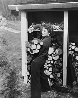 Piling: Woman hauling firewood