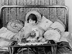 Indulge: Woman having breakfast in bed
